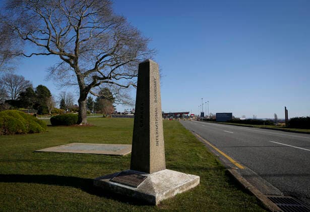 (200321) -- VANCOUVER, March 21, 2020 (Xinhua) -- Empty road is seen in front of a monument marking the geographical border between Canada and the U.S. at Douglas-Peace Arch border crossing in Surrey, Canada, March 20, 2020. Canadian Prime Minister Justin Trudeau announced that the Canada-U.S. border will close to non-essential travel at midnight Friday and both countries will turn back asylum seekers crossing the border. (Photo by Liang Sen Xinhua) CANADA-U.S.-BORDER CLOSE-COVID-19 