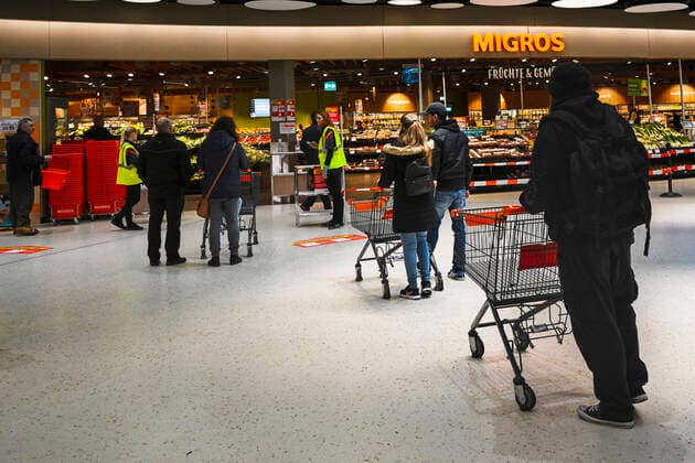 Migros customers waiting in line, Sursee, Switzerland, 21 03 2020