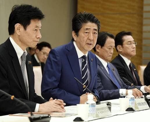 New coronavirus Japanese Prime Minister Shinzo Abe speaks on March 21, 2020, during a meeting in Tokyo on emergency economic measures to deal with the new coronavirus. 