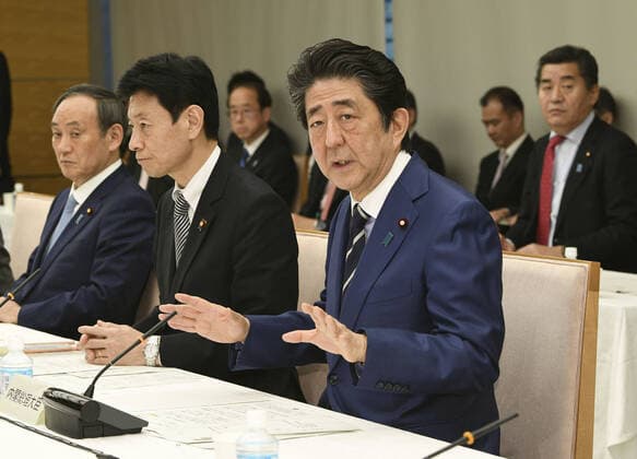 New coronavirus Japanese Prime Minister Shinzo Abe speaks on March 21, 2020, during a meeting in Tokyo on emergency economic measures to deal with the new coronavirus. 