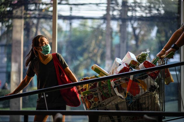 March 21, 2020, Bangkok, Thailand: A woman shopping while wearing a protective mask as a preventive measure against the spread of Coronavirus at a shopping mall in Bangkok..Thailand has so far reported 411 cases of COVID-19 coronavirus with most of the cases reported in the Capital city Bangkok. Bangkok Thailand - ZUMAs197 20200321_zaa_s197_015 Copyright: xAmpholxThongmueangluangx