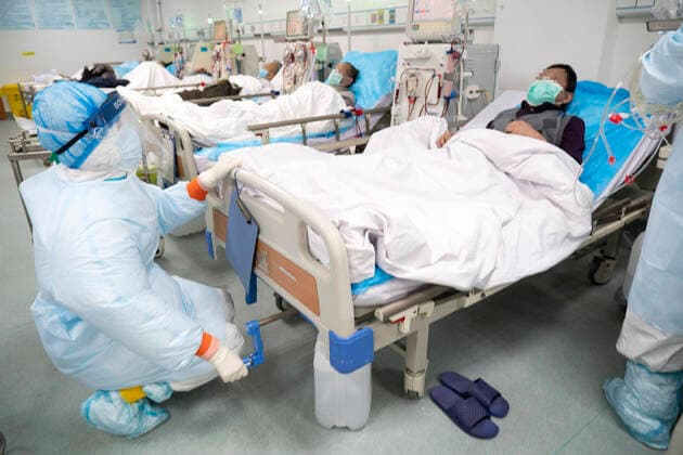 (200321) -- WUHAN, March 21, 2020 -- Medical workers conduct hemodialysis treatment for an uremic patient recovering from COVID-19 infection at Hankou Hospital in Wuhan, capital of central China s Hubei Province, March 21, 2020. Medics at the hemodialysis center of the nephrology department of Hankou Hospital have been sticking to their posts during the novel coronavirus epidemic outbreak. In addition to carrying out blood purification treatment for COVID-19 patients in critical conditions, they also conduct hemodialysis treatment for some 40 uremic patients recovering from COVID-19 infection every week. ) CHINA-HUBEI-WUHAN-MEDICS-HEMODIALYSIS (CN) CaixYang 