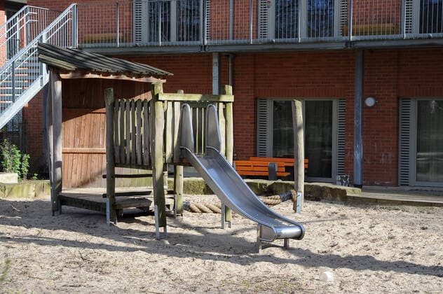To contain the coronavirus a curfew is being discussed, the photo shows an empty childrens playground, playground in a green area, slide, 21 03 2020, Bremen Germany , News, Feature, Coronavirus Bremen xobx