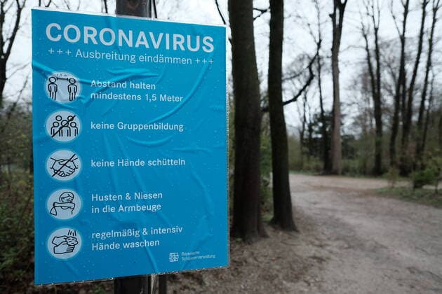 Sign Coroanvirus in the English Garden Restriction in Bavaria due to Corona Pandemic Day 1, Munich on 21 03 2020