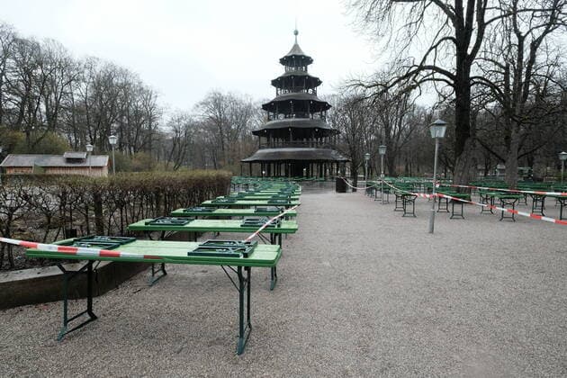 The beer garden at the Chinese Tower is deserted The tables and beer benches are closed off with a flutter band Restriction in Bavaria due to Corona pandemic Day 1, Munich, 21 03 2020