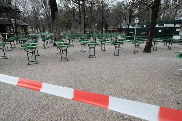 The beer garden at the Chinese Tower is deserted The tables and beer benches are closed off with a flutter band Restriction in Bavaria due to Corona pandemic Day 1, Munich, 21 03 2020