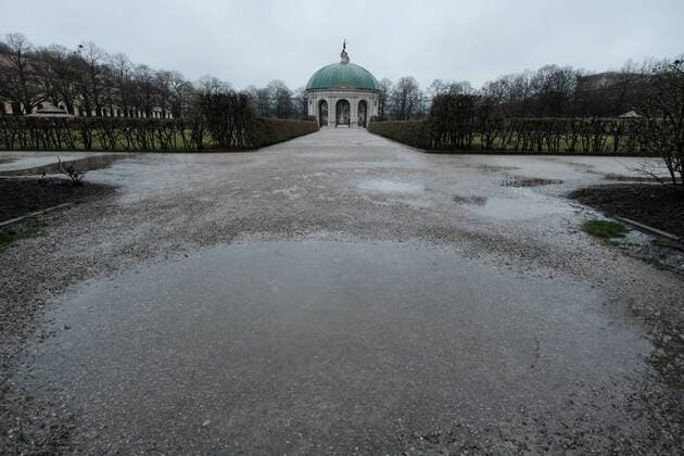 A puddle in front of the Temple of Diana in the Hofgarten Restricted access in Bavaria due to corona pandemic Day 1, Munich on 21 03 2020