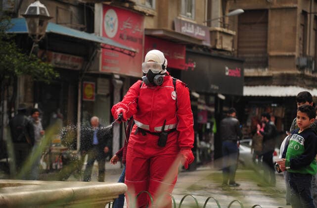 March 21, 2020, Damascus, Damascus, Syrian Arab Republic: Syrian workers disinfect the old market, as a preventive measure amid fears of the spread of the coronavirus, in Damascus, Syria, on March 21, 2020. Even though no cases of coronavirus Covid-19 have yet been reported in the city, some people prefer to take precautionary measures Damascus Syrian Arab Republic - ZUMAap3_ 20200321_zaf_ap3_069 Copyright: xOmarxEstwanix
