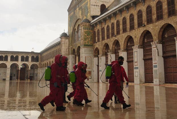 March 21, 2020, Damascus, Damascus, Syrian Arab Republic: Syrian workers disinfect the Great Umayyad Mosque, as a preventive measure amid fears of the spread of the coronavirus, in Damascus, Syria, on March 21, 2020. Even though no cases of coronavirus Covid-19 have yet been reported in the city, some people prefer to take precautionary measures Damascus Syrian Arab Republic - ZUMAap3_ 20200321_zaf_ap3_073 Copyright: xOmarxEstwanix