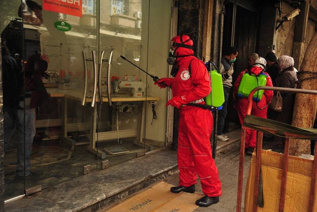 March 21, 2020, Damascus, Damascus, Syrian Arab Republic: Syrian workers disinfect the old market, as a preventive measure amid fears of the spread of the coronavirus, in Damascus, Syria, on March 21, 2020. Even though no cases of coronavirus Covid-19 have yet been reported in the city, some people prefer to take precautionary measures Damascus Syrian Arab Republic - ZUMAap3_ 20200321_zaf_ap3_074 Copyright: xOmarxEstwanix