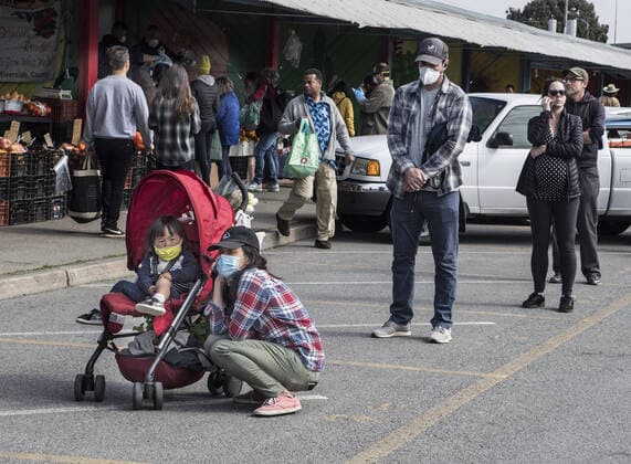 Shoppers at Farmers Market on Alemany Street practice social distancing while waiting in line for produce in San Francisco on Saturday, March 21, 2020. All of California is ordered to shelter in place.  SXP2020032106 TERRYxSCHMITT