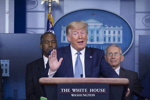 United States President Donald J. Trump, joined by members of the Coronavirus Task Force, makes remarks on the Coronavirus crisis in the Brady Press Briefing Room of the White House in Washington, DC on Saturday, March 21, 2020. At left is United States Secretary of Housing and Urban Development (HUD) Ben Carson; and at right is Director of the National Institute of Allergy and Infectious Diseases at the National Institutes of Health Dr. Anthony Fauci.  WAX20200321207 STEFANIxREYNOLDS