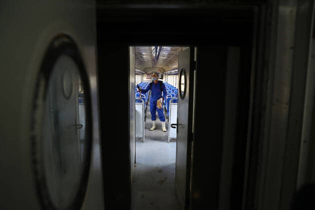 (200321) -- CAIRO, March 21, 2020 (Xinhua) -- A man sprays disinfectant in a train at Ramses railway station in Cairo, Egypt, on March 21, 2020. Egypt announced on Saturday two more deaths from COVID-19 and nine new cases of infection, bringing the total number of confirmed cases to 294 in the country. (Photo by Ahmed Gomaa Xinhua) EGYPT-CAIRO-COVID-19-MEASURES 