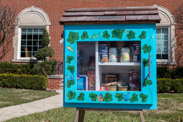 March 21, 2020, Detroit, Michigan, USA: Detroit, Michigan USA - 21 March 2020 - A Little Free Library, converted to a free food exchange distribution because of the coronavirus crisis. The library was placed in front of their home by two ministers, Rev. Vicki Hesse and Rev. Leah McCullough. Detroit USA - ZUMAw66_ 20200321_zaf_w66_009 Copyright: xJimxWestx