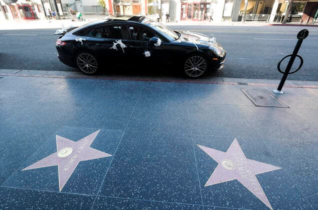 March 21, 2020, Los Angeles, California, U.S: A Porsche is decorated with toilet papers is seen on Hollywood Boulevard on Saturday, March 21, 2020, in Los Angeles. California Gov. Gavin Newsom issued a statewide stay-at-home order Thursday for residents to venture outside only for essential jobs, errands and some exercise, due to coronavirus concerns. Los Angeles U.S. - ZUMAc68_ 20200321_zaf_c68_017 Copyright: xRingoxChiux
