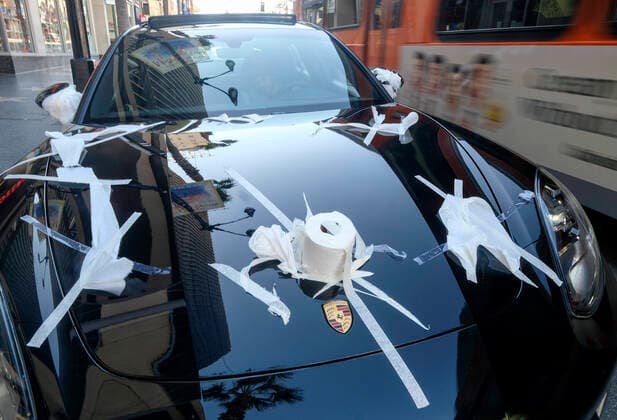 March 21, 2020, Los Angeles, California, U.S: A Porsche is decorated with toilet papers is seen on Hollywood Boulevard on Saturday, March 21, 2020, in Los Angeles. California Gov. Gavin Newsom issued a statewide stay-at-home order Thursday for residents to venture outside only for essential jobs, errands and some exercise, due to coronavirus concerns. Los Angeles U.S. - ZUMAc68_ 20200321_zaf_c68_019 Copyright: xRingoxChiux