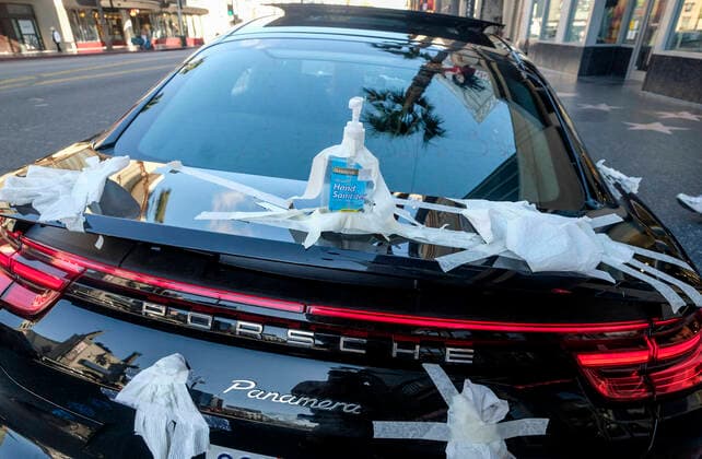 March 21, 2020, Los Angeles, California, U.S: A Porsche is decorated with toilet papers is seen on Hollywood Boulevard on Saturday, March 21, 2020, in Los Angeles. California Gov. Gavin Newsom issued a statewide stay-at-home order Thursday for residents to venture outside only for essential jobs, errands and some exercise, due to coronavirus concerns. Los Angeles U.S. - ZUMAc68_ 20200321_zaf_c68_021 Copyright: xRingoxChiux