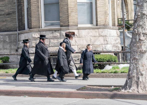 Williamsburg neighborhood reaction to COVID-19 Hasidic Satmar Jewish family walking on streets during Coronavirus outbreak in Williamsburg neighborhood of Brooklyn New York New York United States Copyright: LevxRadin