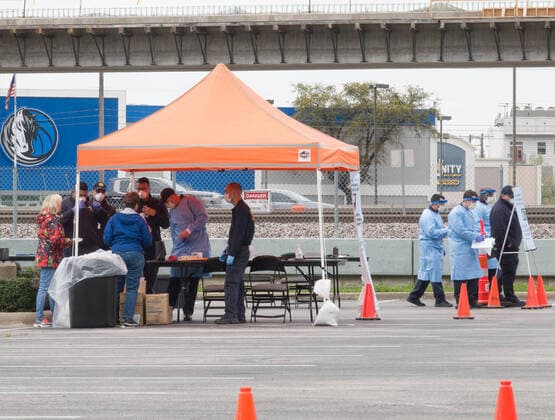 (200322) -- DALLAS, March 22, 2020 (Xinhua) -- Medical workers work at a drive-through COVID-19 testing site in Dallas, Texas, the United States, March 21, 2020. The number of COVID-19 cases in the United States topped 20,000 as of 1:30 p.m. Eastern Standard Time on Saturday (1730 GMT), according to the Center for Systems Science and Engineering (CSSE) at Johns Hopkins University. (Photo by Dan Tian Xinhua) U.S.-TEXAS-DALLAS-COVID-19-TESTING SITES 