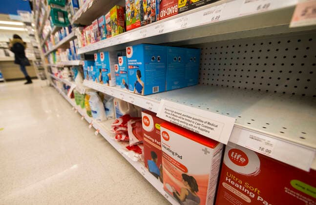 (200322) -- TORONTO, March 22, 2020 -- Empty shelves of medical gloves and masks are seen at a pharmacy in Toronto, Canada, March 21, 2020. With shortages of many items like face masks, surgical gowns, protective eye-wear and hand sanitizers, Canada s Ontario Provincial Premier Doug Ford appealed to the province s manufacturing sector to help produce key medical supplies on Saturday. (Photo by Xinhua) CANADA-TORONTO-COVID-19-MEDICAL SUPPLIES-SHORTAGE ZouxZheng 