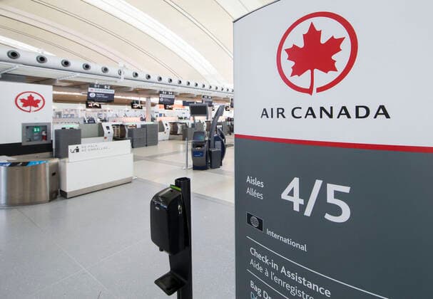 (200322) -- TORONTO, March 22, 2020 -- Check-in counters of Air Canada are seen at the Terminal 1 of Pearson International Airport in Toronto, Canada, March 21, 2020. Air Canada is laying off more than 5,000 flight attendants as the country s largest airline cuts routes and parks planes due to the COVID-19 pandemic. The temporary layoffs will take effect by April. (Photo by Xinhua) CANADA-TORONTO-COVID-19-AIR CANADA-LAY OFF ZouxZheng 