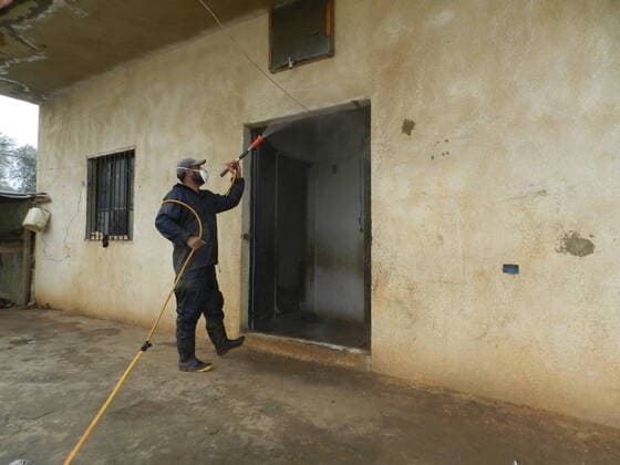 (200322) -- BEIRUT, March 22, 2020 (Xinhua) -- A man disinfects a house belonging to a Syrian refugee family in southern Lebanon on March 21, 2020. Syrian refugee camps and houses in southern Lebanon were disinfected Saturday by local authorities. Lebanon s number of COVID-19 cases increased on Saturday to 206, the National News Agency reported, quoting the health ministry. (Photo by Taher Xinhua) LEBANON-BEIRUT-REFUGEE CAMPS-DISINFECTION 