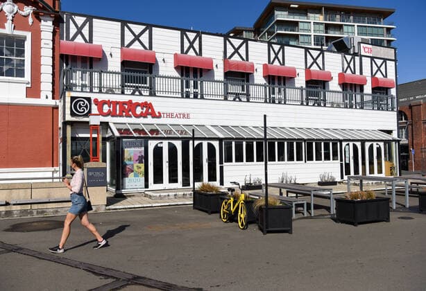 (200322) -- WELLINGTON, March 22, 2020 -- A woman passes by a closed theatre in Wellington, New Zealand, March 22, 2020. New Zealand reported 14 new cases of COVID-19 on Sunday, bringing the total number of confirmed cases to 66. The country is at COVID-19 alert level two. ) NEW ZEALAND-WELLINGTON-ALERT SYSTEM-LEVEL TWO GuoxLei 