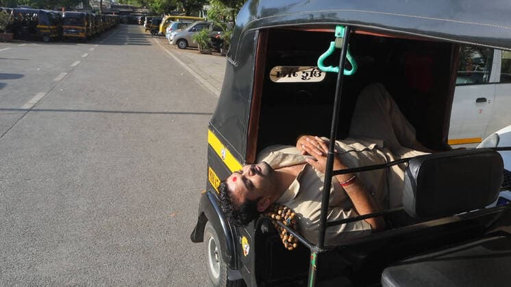March 22, 2020, Mumbai, INDIA: 22 March 2020 : Mumbai - INDIA.A Auto rickshaw driver catches a nap.Streets were seen empty & deserted in response to a National wide covid 19 Lock down Call ordered by Indian prime minister Narendra Modi.As Covid 19 Corona cases spike in India Prime Minister Narendra Modi orders 1 day countrywide Lockdown known as Janata Curfew Mumbai INDIA - ZUMAsu5_ 20200322_zap_su5_024 Copyright: xSubhashxSharmax