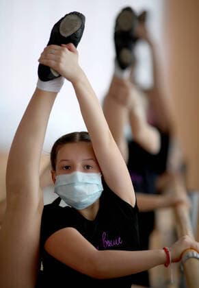IVANOVO, RUSSIA - MARCH 22, 2020: A girl wearing a face mask during a class at a dance studio during the COVID-19 coronavirus pandemic. Vladimir Smirnov TASS  TS0D304A