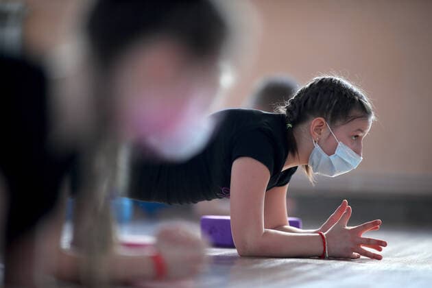 IVANOVO, RUSSIA - MARCH 22, 2020: A girl wearing a face mask during a class at a dance studio during the COVID-19 coronavirus pandemic. Vladimir Smirnov TASS  TS0D304C