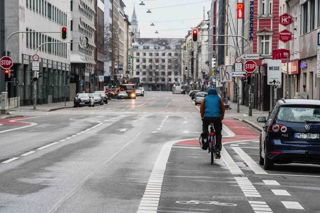 March 22, 2020, Munich, Bavaria, Germany: A bicyclist rides down an unusually empty Schwanthaler Strasse in Munich, Germany. Displays of the empty streets and city center of Munich, Germany after restrictions on public life were put into force. The Interior Ministry has stated that cold weather, rain, and snow is a positive in this case. In comparison to a complete ban, Bavaria still allows highly restricted movement outside of the home and police are prepared act against violations. Munich Germany - ZUMAb160 20200322_zbp_b160_015 Copyright: xSachellexBabbarx