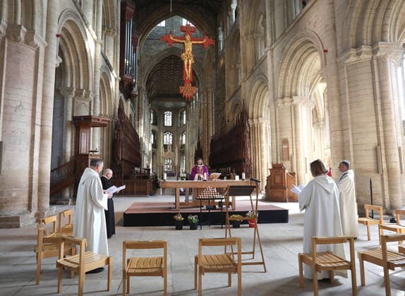 The Mothering Sunday service at Peterborough Cathedral goes ahead without a congregation as it is live streamed across the internet for people to watch wherever they can. The COVID-19 Coronavirus pandemic crisis continues, with cafes, bars, restaurants, gyms and leisure centres forced to close, as well as places of worship like churches, cathedrals, mosques and synagogues. COVID-19 Coronavirus crisis, Peterborough, Cambridgeshire, UK, on March 22, 2020 