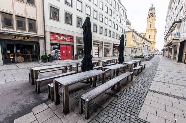 March 22, 2020, Munich, Bavaria, Germany: Tables and chairs outside of restaurants and cafes still locked due to a ban on gastronomie establischments. Displays of the empty streets and city center of Munich, Germany after restrictions on public life were put into force. The Interior Ministry has stated that cold weather, rain, and snow is a positive in this case. In comparison to a complete ban, Bavaria still allows highly restricted movement outside of the home and police are prepared act against violations. Munich Germany - ZUMAb160 20200322_zbp_b160_057 Copyright: xSachellexBabbarx