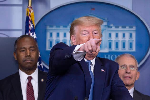 United States President Donald J. Trump, joined by members of the Coronavirus Task Force, gestures as makes remarks on the Coronavirus crisis in the Brady Press Briefing Room of the White House in Washington, DC on Saturday, March 21, 2020. At left is United States Secretary of Housing and Urban Development (HUD) Ben Carson; and at right is Director of the National Institute of Allergy and Infectious Diseases at the National Institutes of Health Dr. Anthony Fauci. Copyright: xStefanixReynoldsx