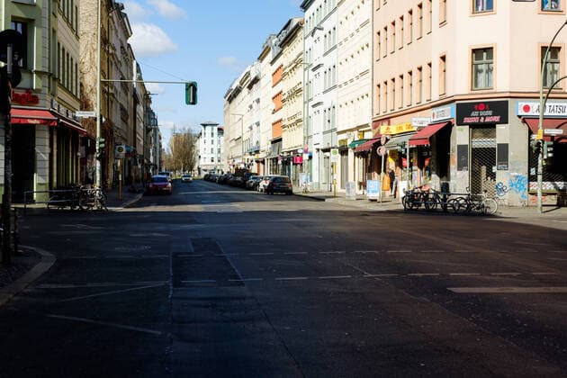 The Oranienstraße in Berlin Kreuzberg at the time of Covid 19 Hardly any people or traffic on the otherwise busy Oranienstraße in Berlin Kreuzberg Due to the current Covid 19 situation, most shops had to close temporarily to slow down the spread of the corona virus , Berlin Berlin Germany Kreuzberg