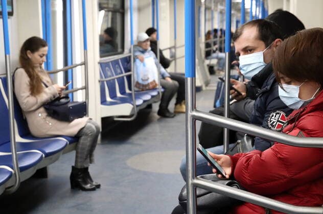 MOSCOW, RUSSIA - MARCH 22, 2020: People wearing face masks in the Moscow Metro amid the COVID-19 coronavirus pandemic. Vyacheslav Prokofyev TASS  TS0D3084
