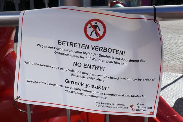 In order to contain the corona virus, business closures have been ordered and curfews are being discussed, the photo shows a sign, notice on a childrens playground, playground with the inscription No trespassing , Because of the corona pandemic, the playground is popular, the playground has been closed by order of the public order office until further notice, 22 03 2020, Bremen Germany , News, Feature, Coronavirus Bremen xobx
