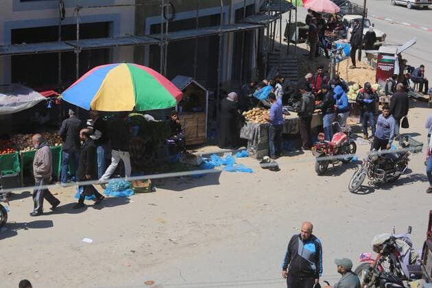 March 22, 2020, Deir Al-Balah, The Gaza Strip, Palestine: Palestinians at Deir al-Balah city market in central of the Gaza Strip, Markets of the Gaza strip are witnessing an increase in demand after announce first two cases of coronavirus in the Gaza Strip. Deir Al-Balah Palestine - ZUMAq100 20200322_zaa_q100_028 Copyright: xMahmoudxKhattabx