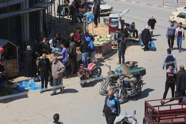 March 22, 2020, Deir Al-Balah, The Gaza Strip, Palestine: Palestinians at Deir al-Balah city market in central of the Gaza Strip, Markets of the Gaza strip are witnessing an increase in demand after announce first two cases of coronavirus in the Gaza Strip. Deir Al-Balah Palestine - ZUMAq100 20200322_zaa_q100_030 Copyright: xMahmoudxKhattabx
