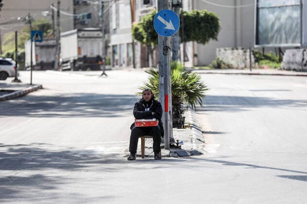 March 22, 2020, Gaza City, Gaza Strip, Palestinian Territory: A street is seen almost empty as a preventive measure against the coronavirus, in Gaza City, on March 22, 2020. Authorities in Gaza confirmed the first two cases of novel coronavirus, identifying them as Palestinians who had travelled to Pakistan and were being held in quarantine since their return. The United Nations has warned that a COVID-19 outbreak in Gaza could be disastrous, given the high poverty rates and weak health system in the coastal strip under Israeli blockade since 2007 Gaza City Palestinian Territory - ZUMAap3_ 20200322_zaf_ap3_174 Copyright: xYasserxQudihx