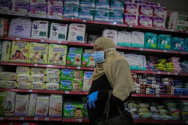 March 22, 2020, Gaza City, The Gaza Strip, Palestine: Palestinians at supermarket in Gaza city, Markets of the Gaza strip are witnessing an increase in demand after announce first two cases of coronavirus in the Gaza Strip. Gaza City Palestine - ZUMAq100 20200322_zaa_q100_040 Copyright: xAbedxAlrahmanxAlkahloutx