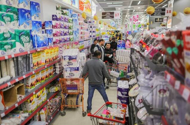 March 22, 2020, Gaza City, The Gaza Strip, Palestine: Palestinians at supermarket in Gaza city, Markets of the Gaza strip are witnessing an increase in demand after announce first two cases of coronavirus in the Gaza Strip. Gaza City Palestine - ZUMAq100 20200322_zaa_q100_044 Copyright: xAbedxAlrahmanxAlkahloutx