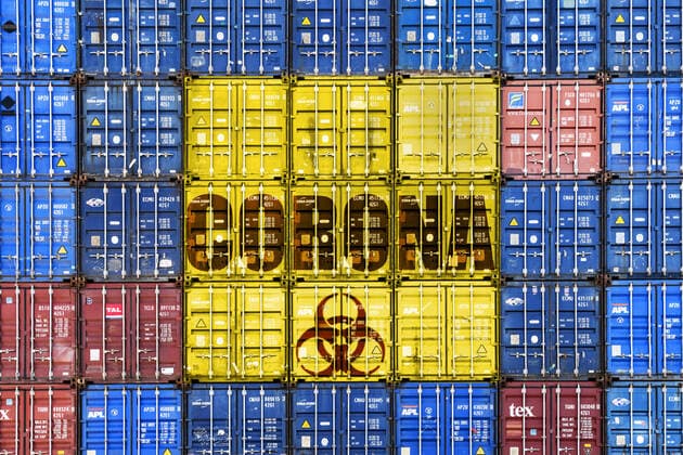 PHOTOMONTAGE, Stacked containers with corona and biohazard signs, topic coronavirus and economic crisis ** NUR FUER REDAKTIONELLE ZWECKE ** EDITORIAL USE ONLY **