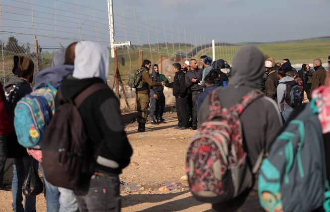 (200322) -- HEBRON, March 22, 2020 -- Palestinian workers try to enter Israel through a checkpoint between the West Bank city of Hebron and Beersheva, March 22, 2020. The Israeli authorities announced late on Saturday that all crossings to and from Israel will be closed to limit the spread of COVID-19. A total of 53 Palestinians have been infected with the virus since March 5, and 17 of them have recovered, the health ministry in the West Bank said earlier Saturday. (Photo by Mamoun Wazwaz Xinhua) MIDEAST-HEBRON-CROSSING POINTS-CLOSURE-WORKERS xiongsihao 