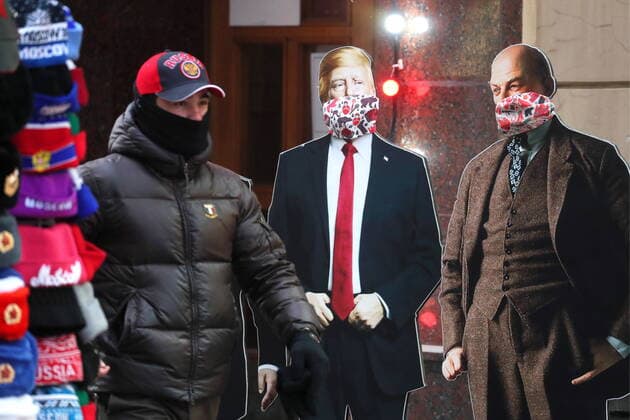 MOSCOW, RUSSIA - MARCH 22, 2020: Cardboard cutouts of Donald Trump and Vladimir Lenin with face masks on, amid the ongoing COVID-19 pandemic. Sergei Savostyanov TASS  TS0D30E7