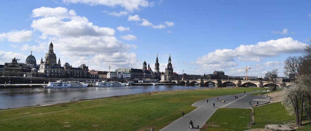 GER Dresden because of the initial restrictions due to the corona pandemic epidemic disease disease are in the city center of Dresden squares and streets are empty as here the bike paths on the banks of the Elbe with city silhouette skyline with Frauenkirche and Hofkirche and Augustusbruecke 22 03 20 220320 ddbd