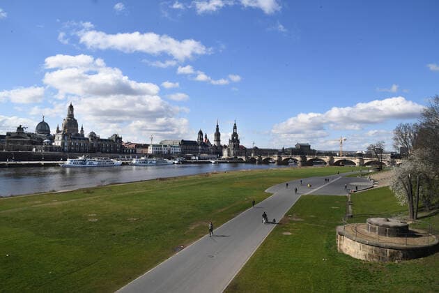 GER Dresden because of the initial restrictions due to the corona pandemic epidemic disease disease are in the city center of Dresden squares and streets are empty as here the bike paths on the banks of the Elbe with city silhouette skyline with Frauenkirche and Hofkirche and Augustusbruecke 22 03 20 220320 ddbd