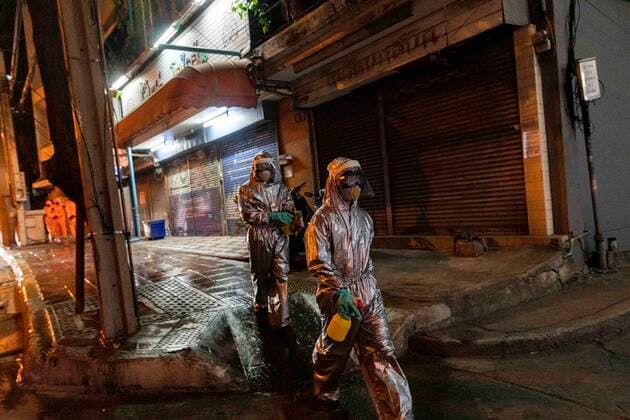 March 22, 2020, Bangkok, Bangkok, Thailand: Members of the Royal Thai Army have conducted sanitization activities in Bangkok nightly since March 19th in an effort to slow the spread of the Covid-19 virus, descending on areas of the city that see heavy pedestrian traffic. Wearing protective suits the soldiers and volunteers spray the sidewalks with chemical disinfectant and also clean high touch surfaces such as guard rails and ATM machines. Thailand s number of confirmed Covid-19 cases rose to 599, an increase of 188 from the day prior, the largest 1 day increase the country has seen so far. Bangkok Thailand - ZUMAt128 20200322_zap_t128_001 Copyright: xAdryelxTalamantesx