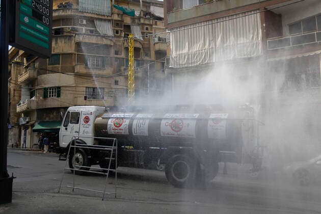 (200322) -- BEIRUT, March 22, 2020 (Xinhua) -- A sanitation vehicle sterilizes a street in Beirut, Lebanon, March 22, 2020. Lebanon s number of COVID-19 infected cases increased on Sunday by 18 to 248, the National News Agency reported. Lebanon deployed on Sunday security forces all over the country to prevent people from leaving their houses in an attempt to restrict the spread of COVID-19. (Photo by Bilal Jawich Xinhua) LEBANON-BEIRUT-COVID-19-MEASURES 