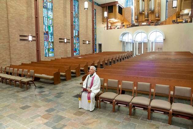March 22, 2020, Austin, Texas, USA: Pastor John Van Haneghan of Saint Martin s Lutheran Church readies his sermon to an empty sanctuary that would normally hold several hundred worshipers on Sunday morning in downtown Austin. The church is offering online services while crowd restrictions are in place due to the coronavirus pandemic. Austin USA - ZUMAd150 20200322_znp_d150_006 Copyright: xBobxDaemmrichx